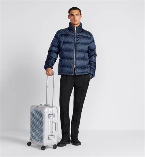 dior and rimowa carry-on luggage